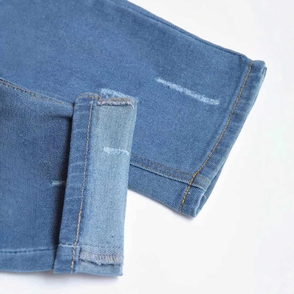 Slim Stretch Destroyed Jeans for Men - Fashionable Skinny Leg Denim with Edgy Ripped Accents