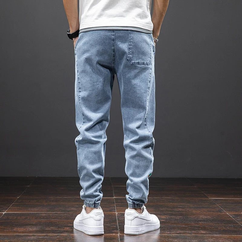 Large size elastic workwear jeans, men's ankle tied Harlan pants, wear-resistant and fat added, plus size trendy and loose