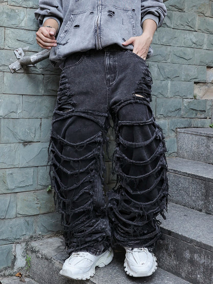 Men's black jeans. With a design of (ripped holes) and tassels. In a street trend style.