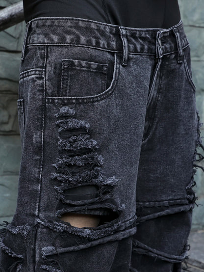 Men's black jeans. With a design of (ripped holes) and tassels. In a street trend style.