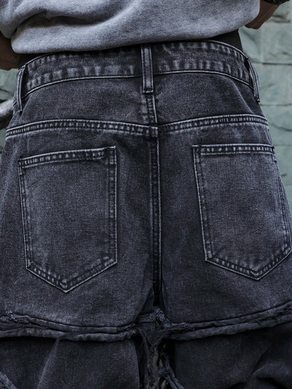 Men's black jeans. With a design of (ripped holes) and tassels. In a street trend style.