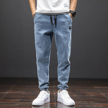 Large size elastic workwear jeans, men's ankle tied Harlan pants, wear-resistant and fat added, plus size trendy and loose