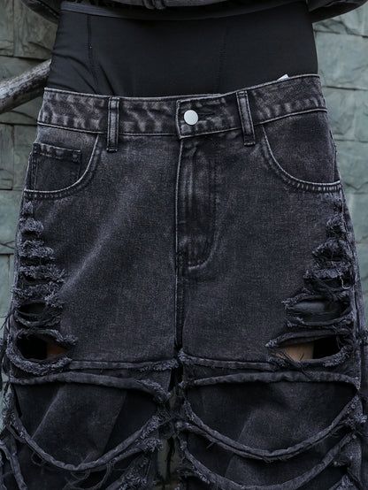 Men's black jeans. With a design of (ripped holes) and tassels. In a street trend style.